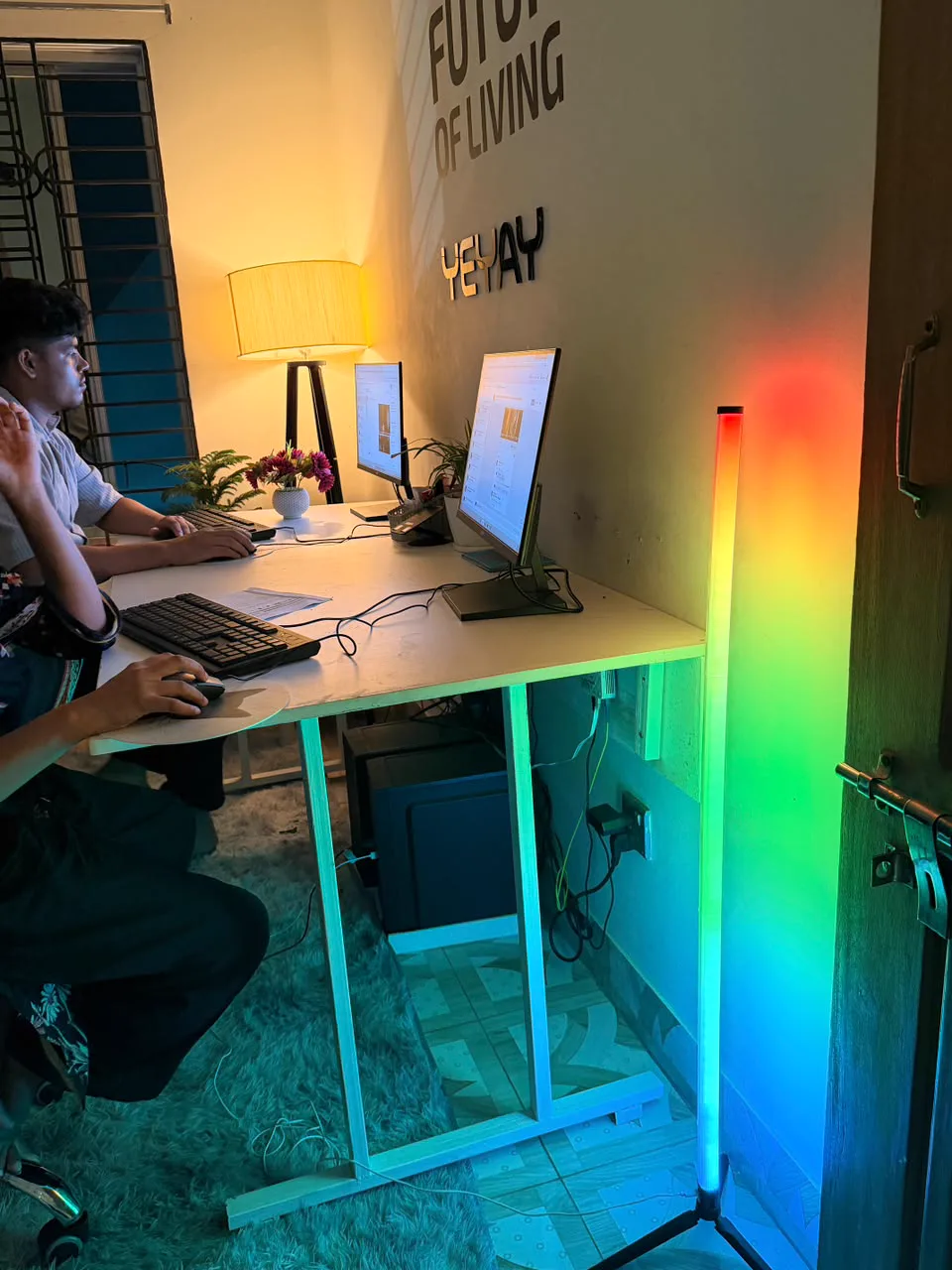 YEYAY office desks lit by an RGB smart floor lamp